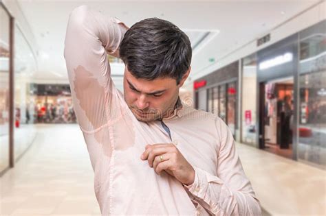 Man With Sweating Under Armpit In Shopping Center Stock Photo Image