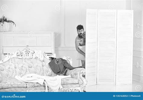 hipster naked on shocked face unexpectedly detected in bedroom exposing lovers concept stock