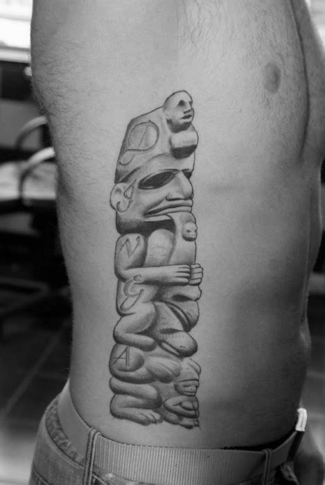3d like black and white mystical tribal statue tattoo on side tattooimages