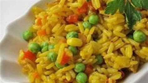 A Colorful And Savory Herbed Rice Dish With Carrots Red Bell Peppers