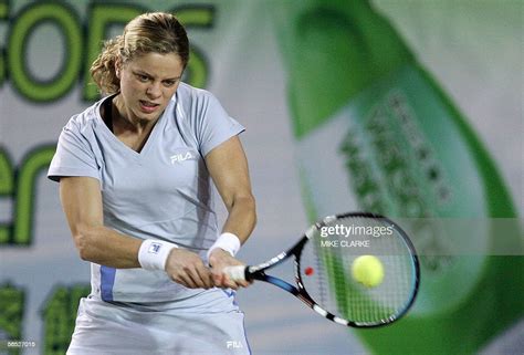Belgian Tennis Player Kim Clijsters Returns A Ball During Her News