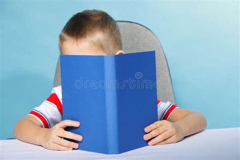 Child Boy Kid Reading A Book On Blue Stock Image Image Of Library