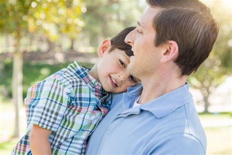 Happy Caucasian Father And Son Hug In The Park Stock Photo Image Of