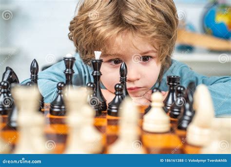 Little Boy Playing Chess Boy Kid Playing Chess At Home Stock Photo