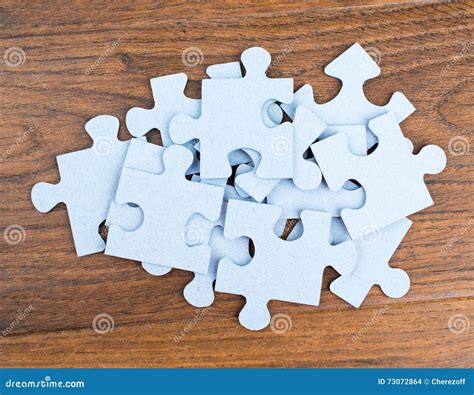 Pile Of Puzzle Pieces On Table Royalty Free Stock Image
