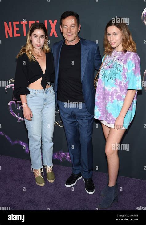 Actor Jason Isaacs Center Poses With Daughters Lily And Ruby At The