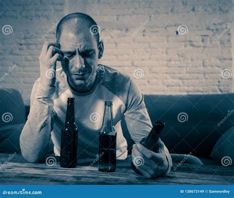 people depression men and alcohol addiction concept depressed man drinking alcohol at home