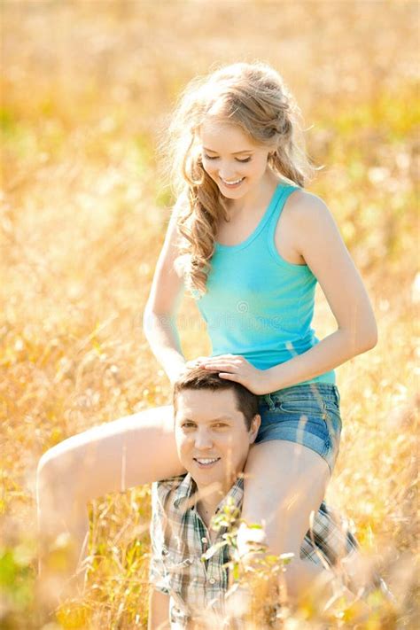 Happy Young Adult Couple In Love On The Field Two Man And Wom Stock