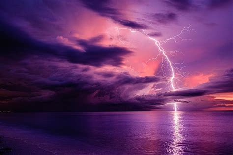 Sunset Lightning Strike Over Barefoot Beach In Florida Photograph By