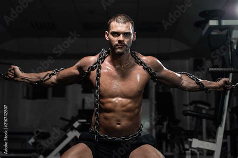 Muscular Man Slave In Chains In Gym The Prisoner Stock Photo Adobe Stock