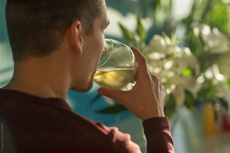 Man Drinking Wine By Stocksy Contributor Mosuno Stocksy