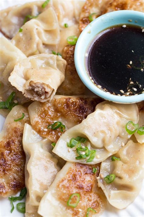 If you have never had homemade gyoza dipping sauce, you are in for a serious treat! Easy chicken gyozas on a plate with a side dish of gyoza ...