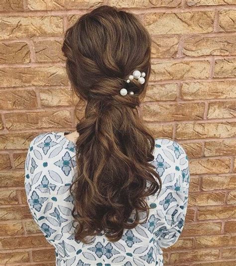 Leave out a chunky portion of hair at the front to sweep to the side in a grand fashion, pull that ponytail up high. 50 Best Ponytail Hairstyles to Update Your Updo in 2020