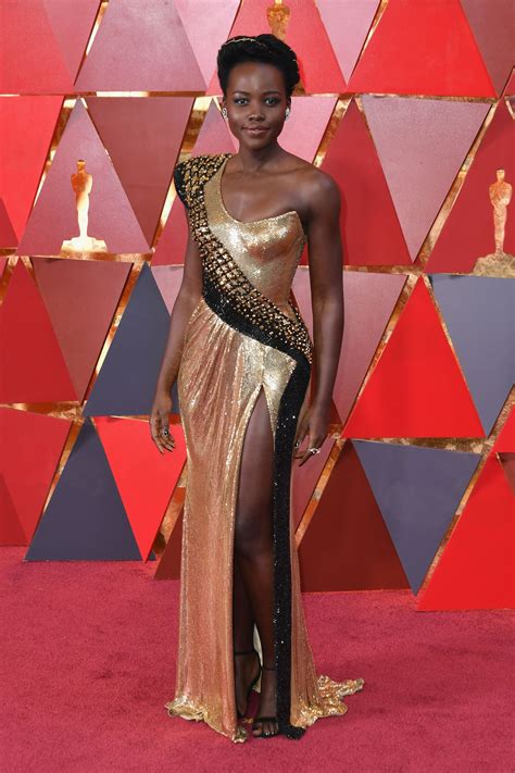 Lupita nyong'o stuns on the red carpet in pearl white dress and sparkling stiletto pumps at google and netflix event. Lupita Nyong'o - Oscars 2018 Red Carpet