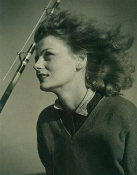 An Old Black And White Photo Of A Woman Holding A Baseball Bat Over Her