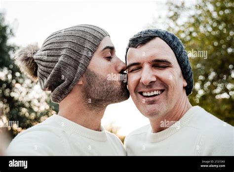 Mature Gay Couple Kissing Outside Male Lovers Taking Selfie Picture