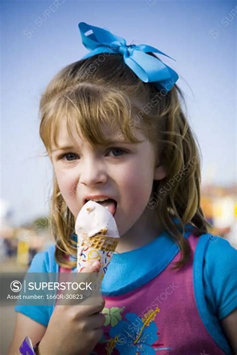 Babe Girl Eating Ice Cream Cone SuperStock