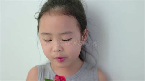 Asian Girl Sucking Lollipop Stock Footage Video Of Camera Looking