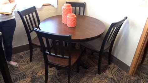 This dining set includes a table, four side chairs and bench. Ashley Furniture Owingsville Round Dining Table Set D58015 ...