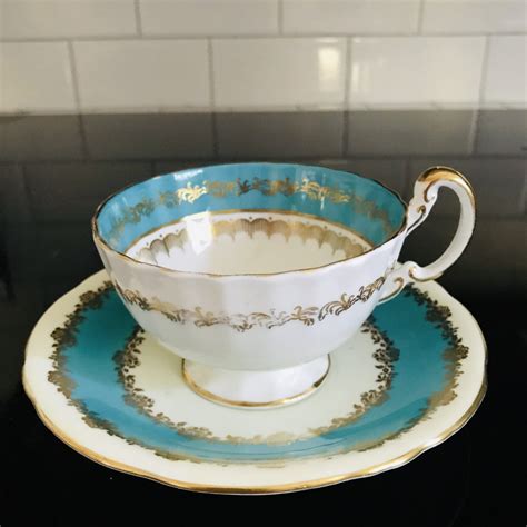 Aynsley Tea Cup And Saucer Turquoise Blue Floral Center Pattern Fine
