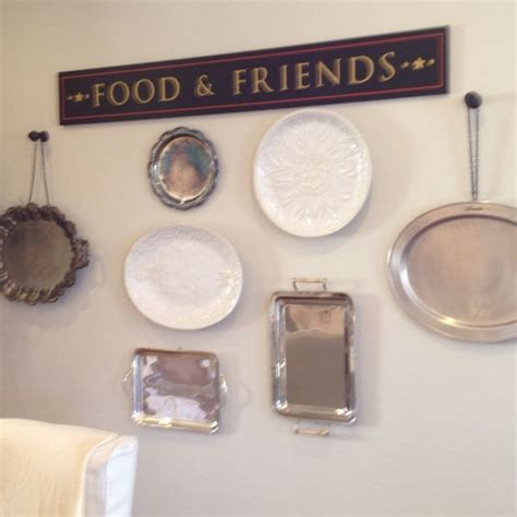 Different Sized Plates And Platters Placed On A Wall Kitchen Or Dining Ro