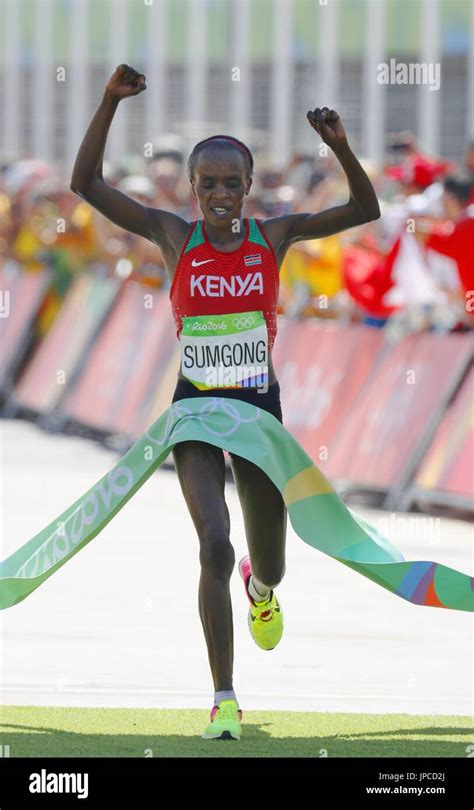 Kenyas Jemima Sumgong Crosses The Finish Line To Win The Womens