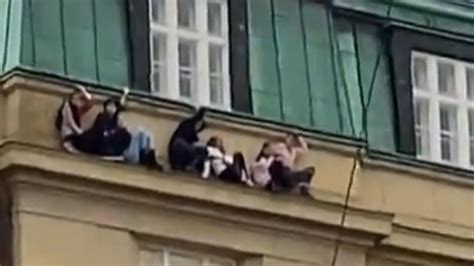 Prague Footage Shows People Hiding On Ledge Of Building Amid Mass