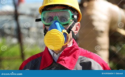 Worker In Hard Hat Goggles And Respirator On Electropower Station