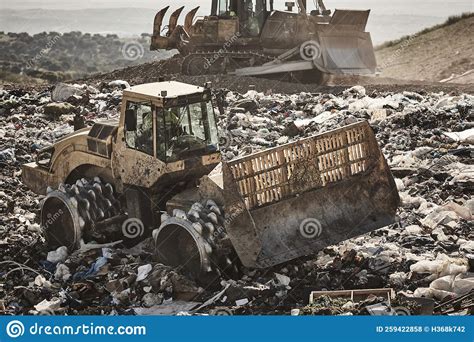 Heavy Machinery Shredding Garbage In An Open Air Landfill Pollution Stock Photo Image Of