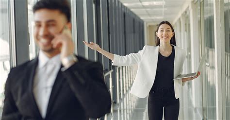 Cheerful Colleagues Standing In Modern Office · Free Stock Photo