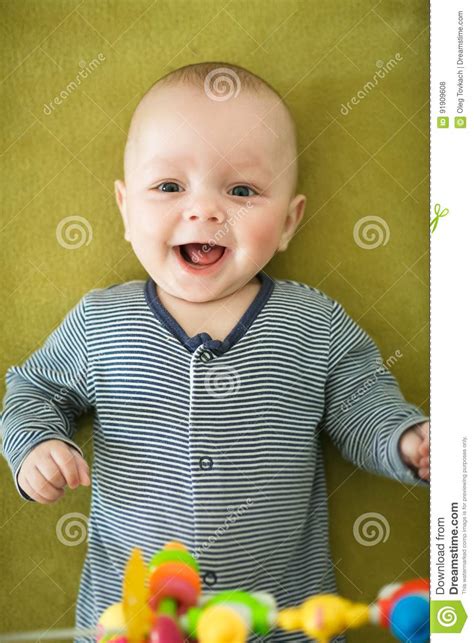 Newborn Boy Is Lying In The Bed Stock Photo Image Of Laugh Beautiful