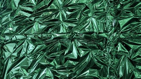 Green Metal Foil Wrinkled And Shiny Close Up Abstract Image