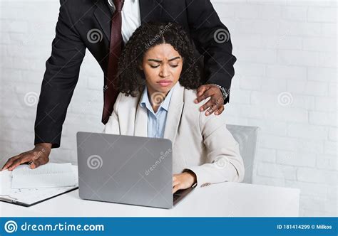 Harassment With A Boss Touching The Arm To His Secretary Who Is Sitting