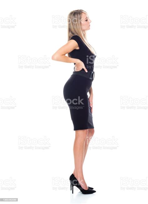 Caucasian Female Businesswoman Bending Over In Front Of White