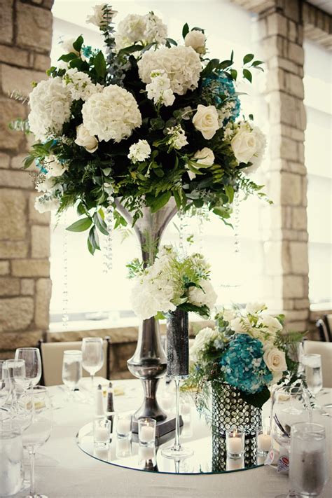 You will receive the 15 frames very similar (if not the same) as the ones in these photos. elegant wedding reception centerpieces ivory hydrangeas teal accents | OneWed.com