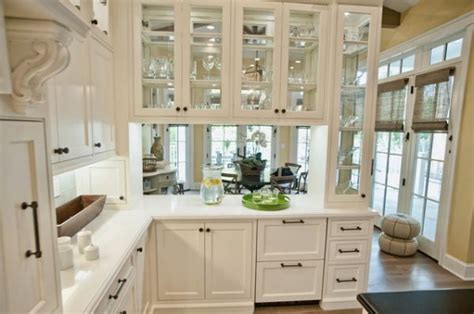 It helps to break up the monotony of rows of flat front cabinets, lance thomas, designer and half of the duo. A Mix Of Functionality And Style In The Form Of Glass Kitchen Cabinets