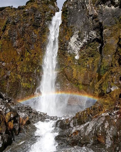 Rainbow Through A Waterfall Arthurs Pass National Park New Zealand