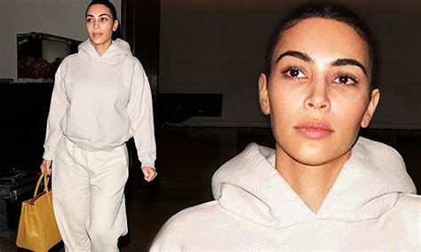 Kim Kardashian Rocks A Sweatsuit And Goes Makeup Free As She Carries A