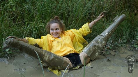 Vivienne getting hot wading in the deep mud. Yellow Rainwear Mud and Water: Nice playing in Hunters and ...