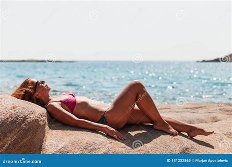 Young Woman Tanning On The Beach Stock Image Image Of Beauty Remote