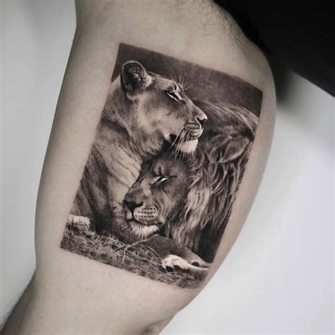 Micro Realistic Lion And Lioness Tattoo Located On The