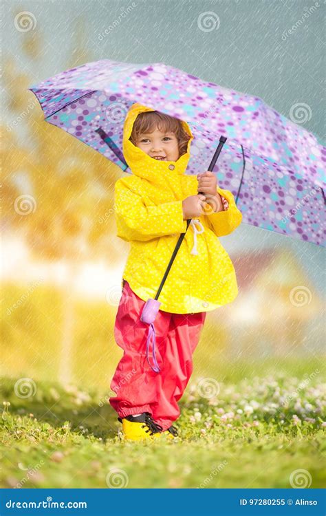 Rainy Day Happy Toddler Girl Wearing Waterproof Coat With Umbrella
