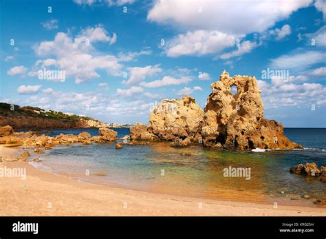 Golden Beaches And Sandstone Cliffs Near Albufeira Portugal Stock