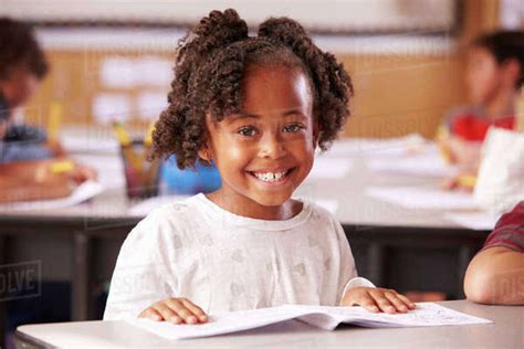 Portrait Of African American Elementary School Girl In Class Stock