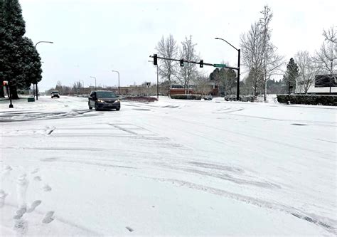 monday s snow slick roads delay agency city office openings across portland area