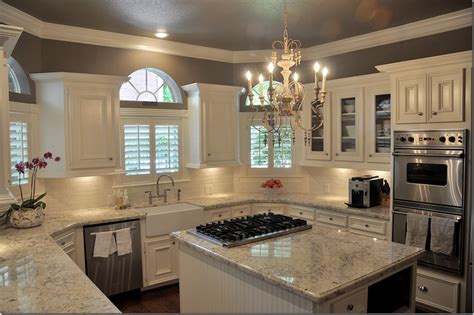 Kitchen cream cabinets dark wood floors and backsplash. Dark wood floor, white & gray granite, white cabinets, cream backsplash