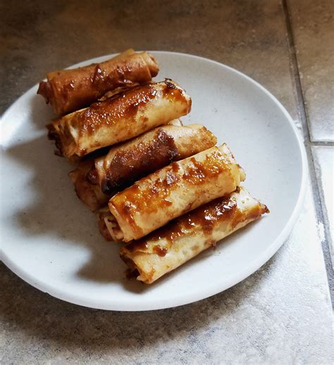 Filipino cuisine is the ultimate fusion food! Crispy and sweet Turon filled with Langka (jackfruit) and banana. Coated with caramelized brown ...