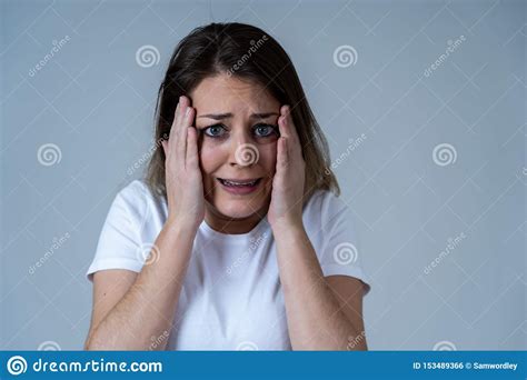 Portrait Of A Young Attractive Woman Looking Scared And Shockedhuman