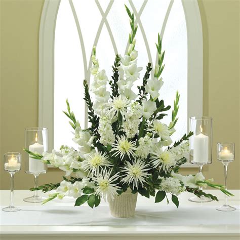 A 'long & low' church altar design that can double up as a top table centrepiece back at the wedding breakfast. Church Altar Weddings Flowers Arrangement - OOSILE