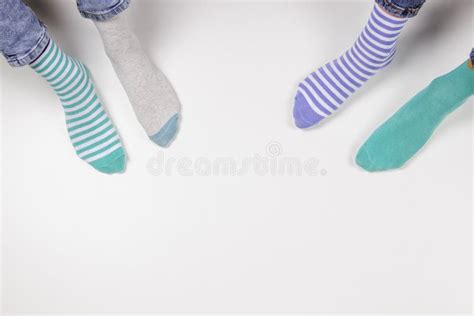 Kid Wearing Different Pair Of Socks Child Foots In Mismatched Socks